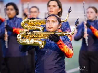 A GIRL HOLDING SAXOPHONE