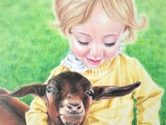 child holding a goat