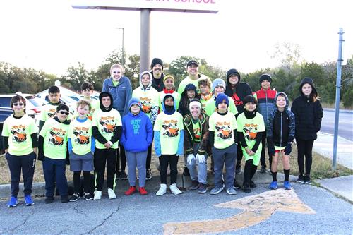 Coach Sellers with Fox Run students at the 5k