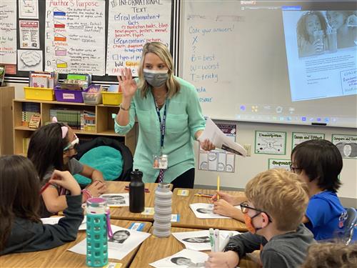 Alison teaching in front of the class