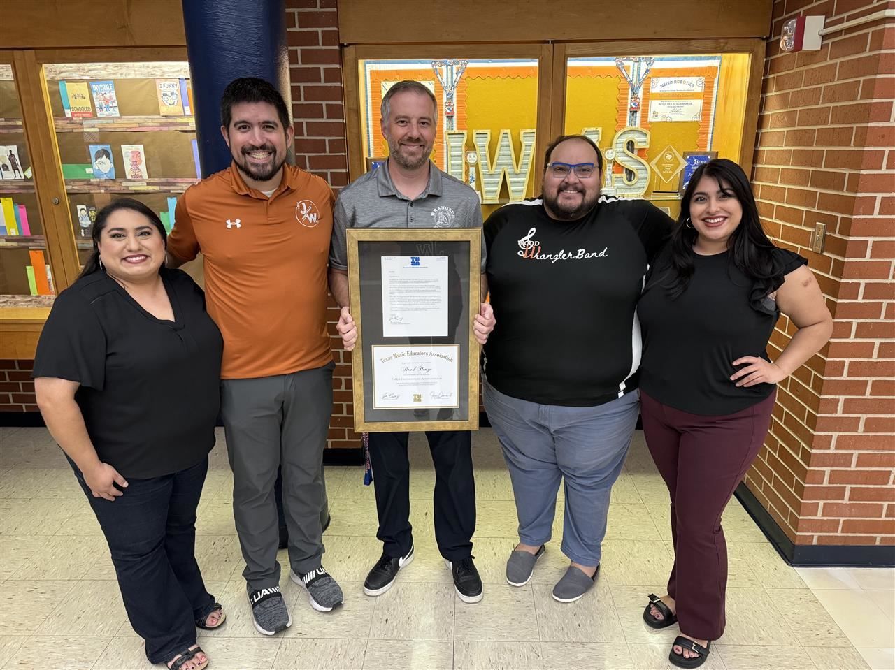 Brad Henze and Wood music teachers celebrate TMEA Award