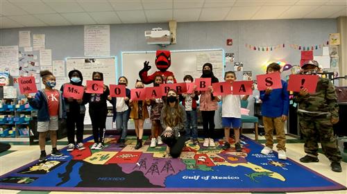 Teacher with her students