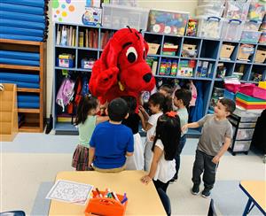 students with Clifford the big red dog